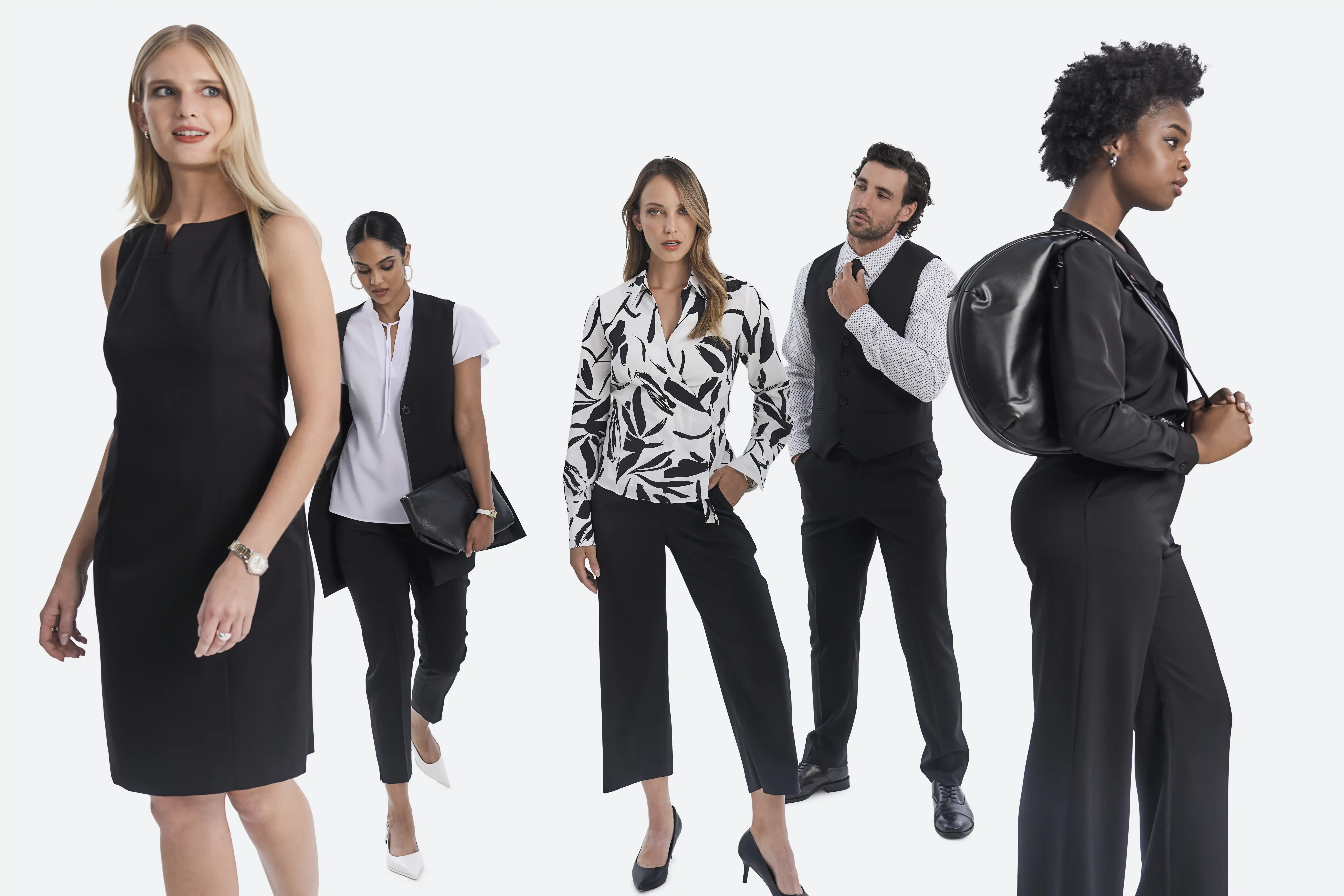 A team of diverse employees wearing black and white coordinated company uniforms